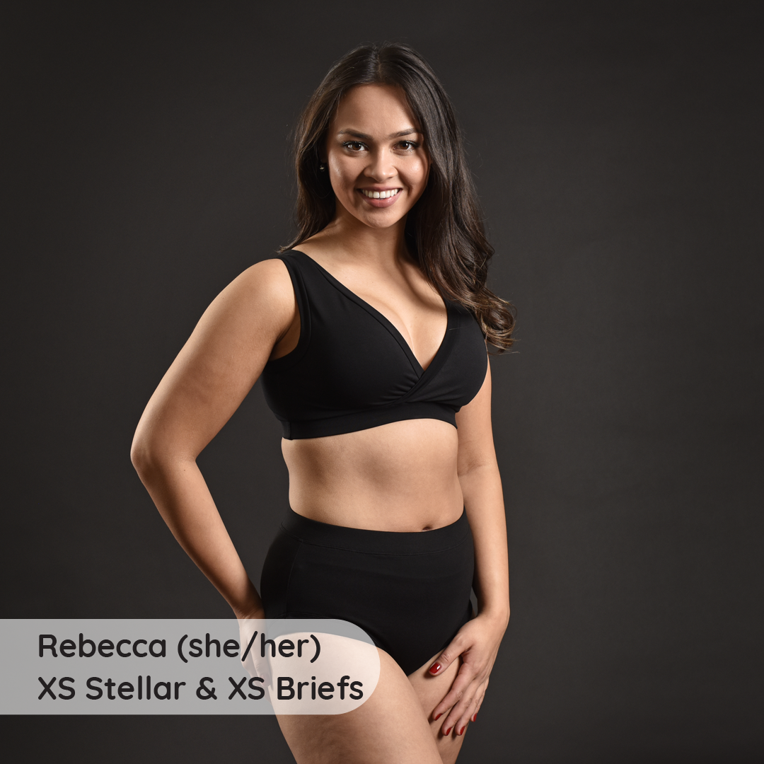 Rebecca is wearing a black underwear set with high rise briefs
