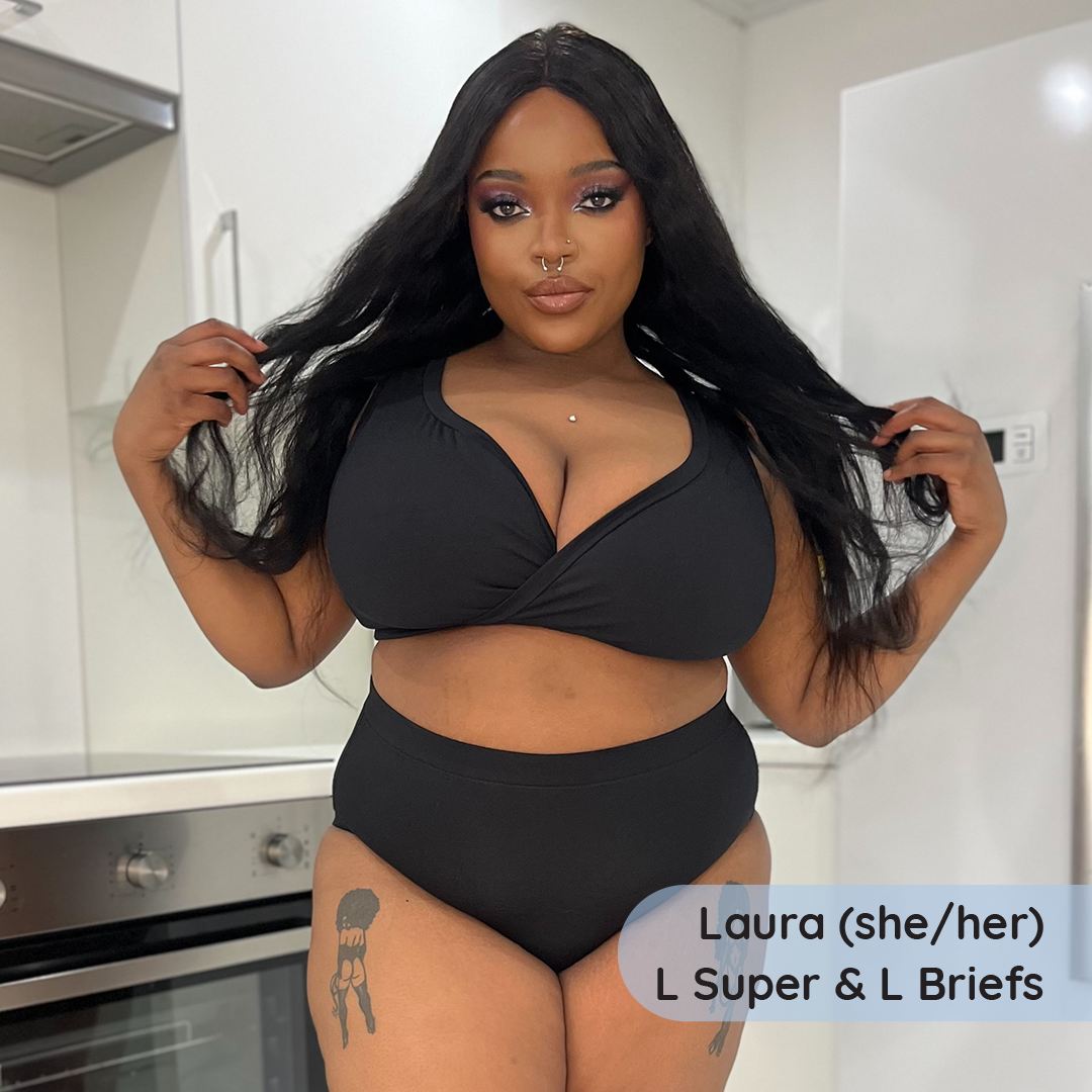 Laura is wearing a black non wired bra and high rise briefs