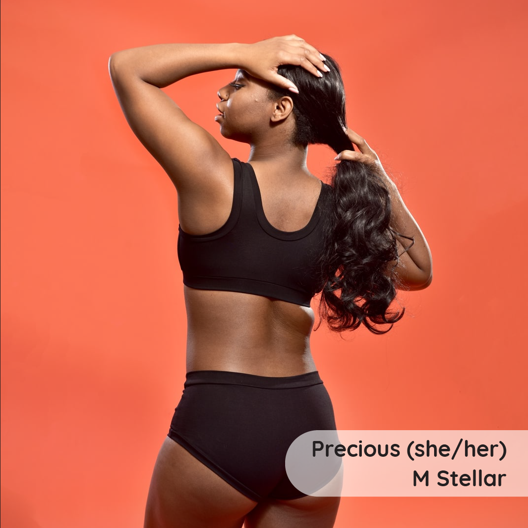 Precious is wearing a Black Molke Bra and Briefs.  Back view