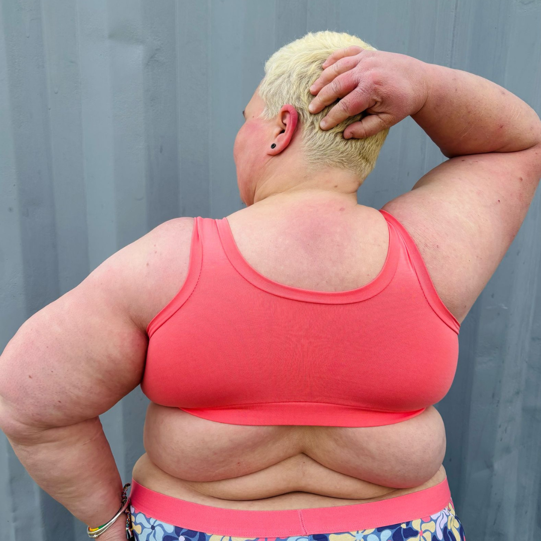 Back view of Estelle wearing a coral pull on wire free bra