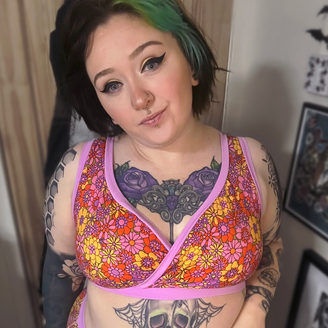 Chantelle is at home and wearing a crossover style bra and briefs in Flora print.