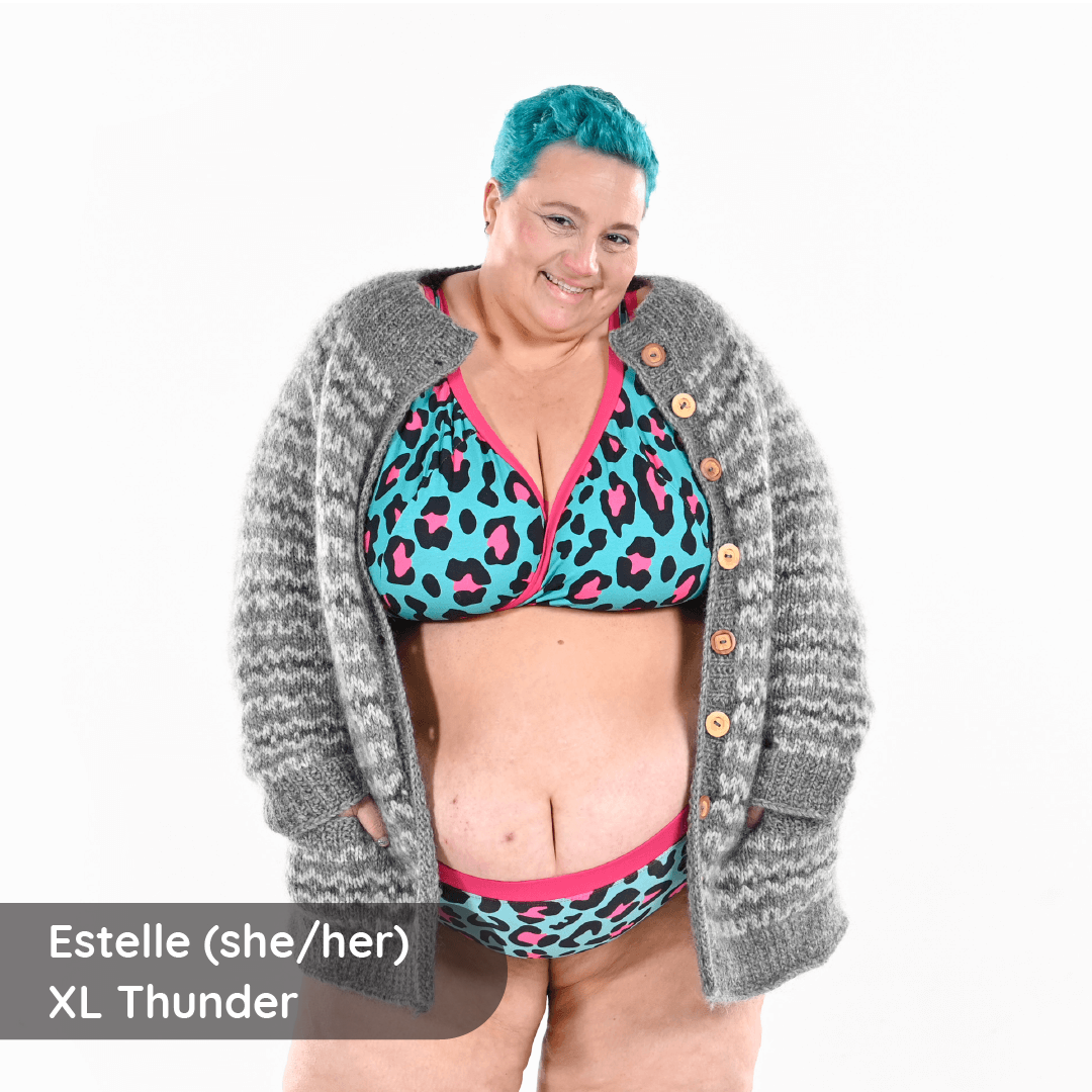 Estelle is wearing a fuller bust leopard bra and briefs with a cardigan