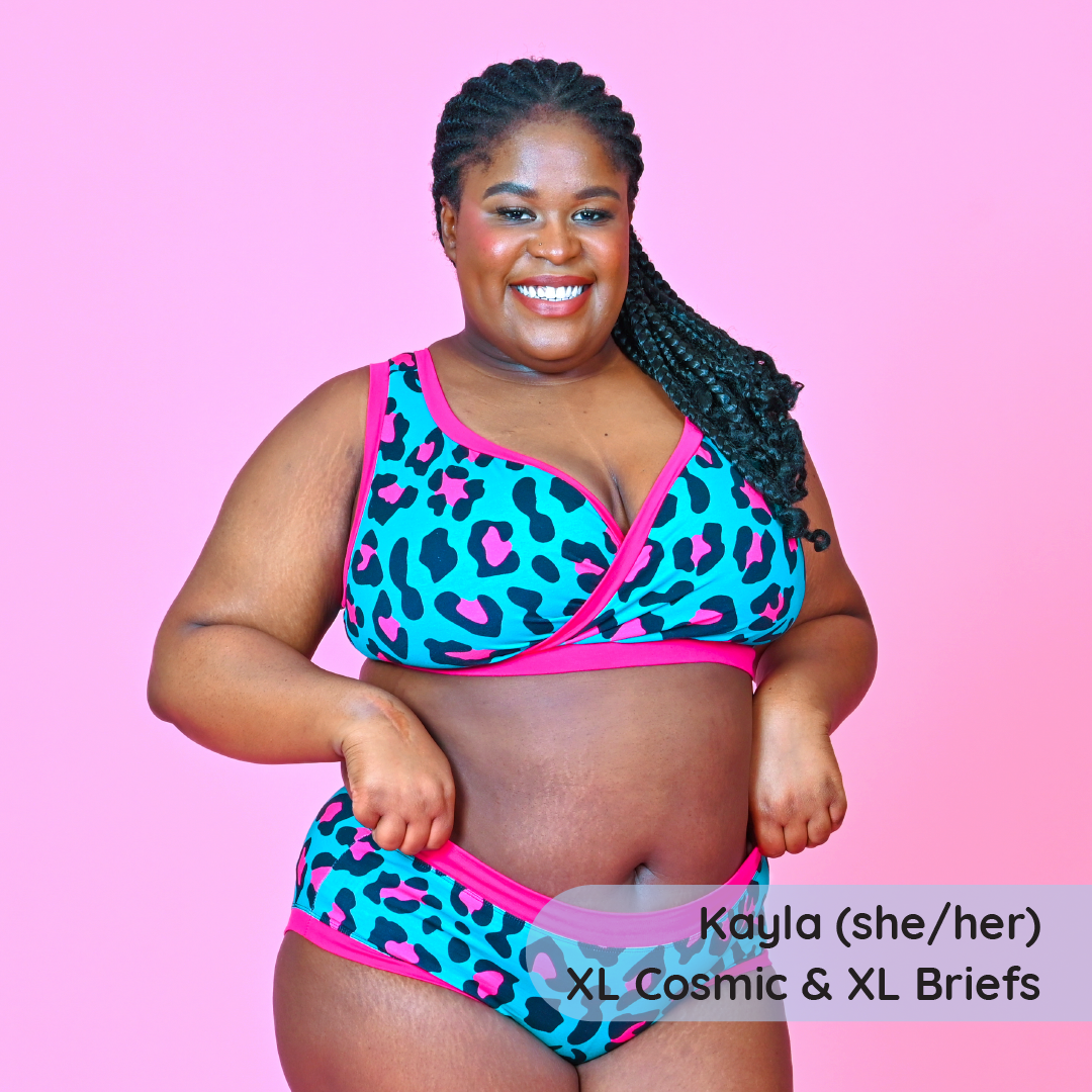 Kayla is wearing a hot pink and teal leopard print bra