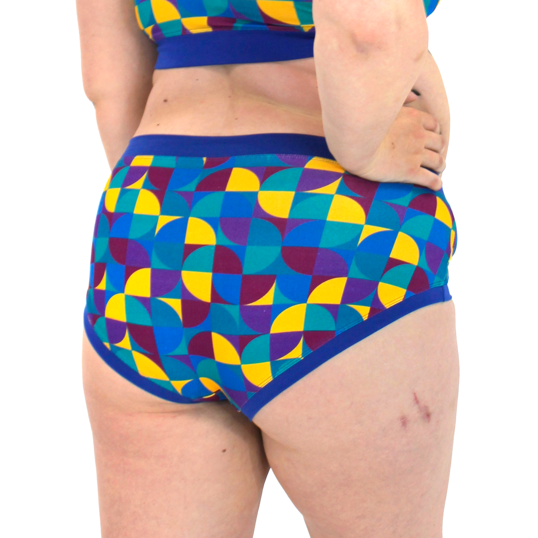 Colorful geometric-patterned cotton briefs on a white background