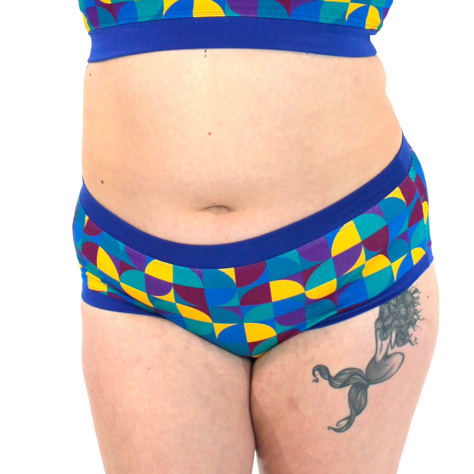 Colorful geometric-patterned underwear with a blue waistband on a white background