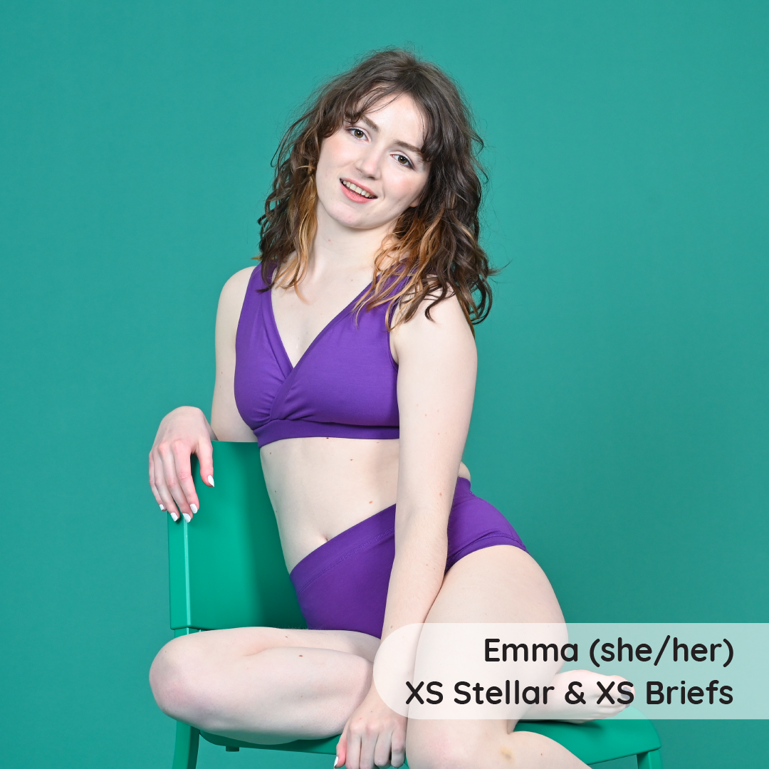 Emma is wearing a purple Iris underwear set