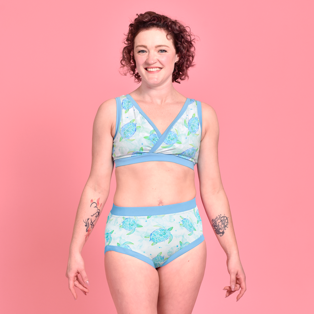 Jenni is wearing a Turtles non-wired bra and high rise briefs.