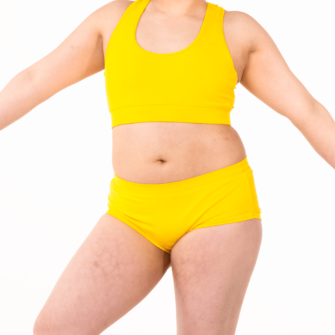 Crop of Jacqueline wearing a yellow cotton underwear set