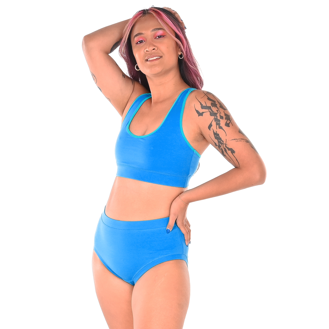 Sarah is wearing a aqua blue lagoon bralette and briefs