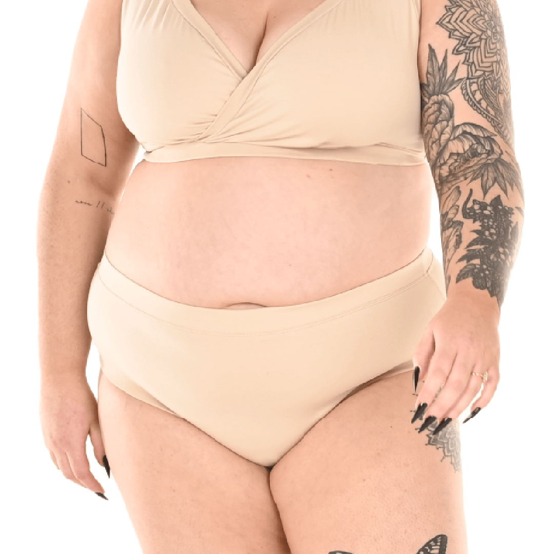 Crop of Bex wearing a nude underwear set with high rise briefs