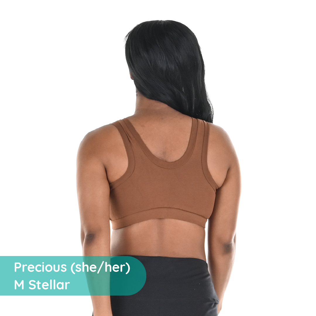 Back view of Precious wearing a brown skin tone bra