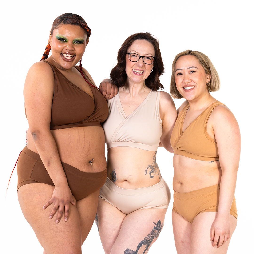 Group shot of 3 models wearing different shades of nude underwear