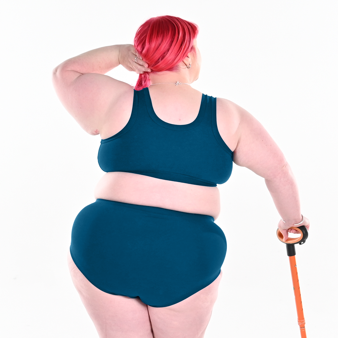 Back view of Rhona wearing a Petrol blue pull on bra and cotton briefs