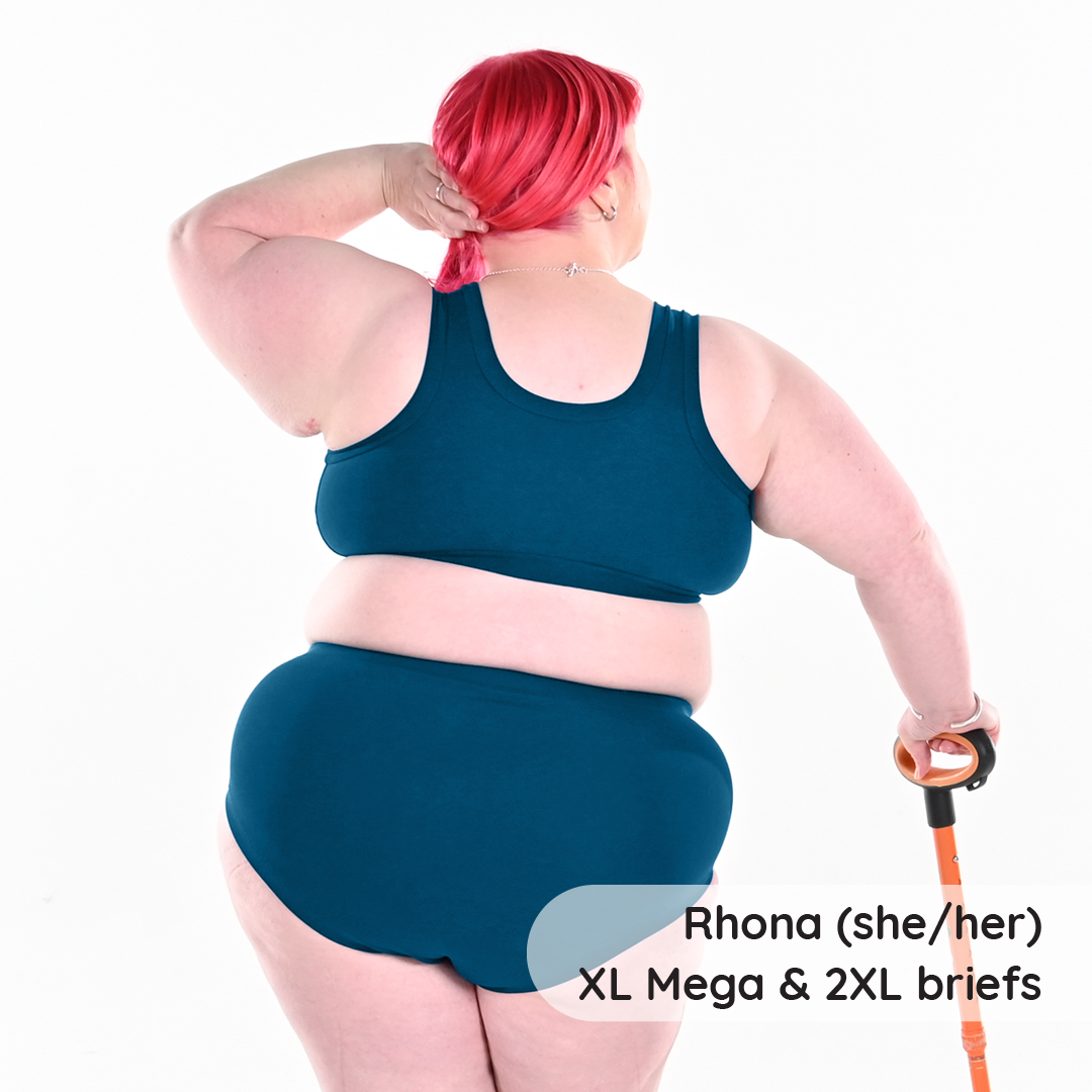 Back view of Rhona in a pull on petrol blue bra and briefs