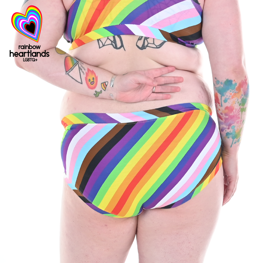 Back view of Autumn wearing Pride flag briefs