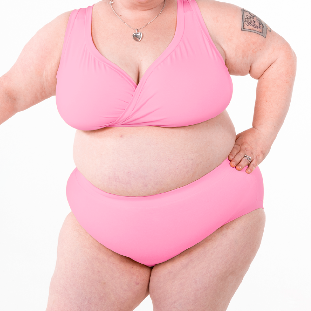 Rhona is wearing a pale pink non wired bra and high rise briefs