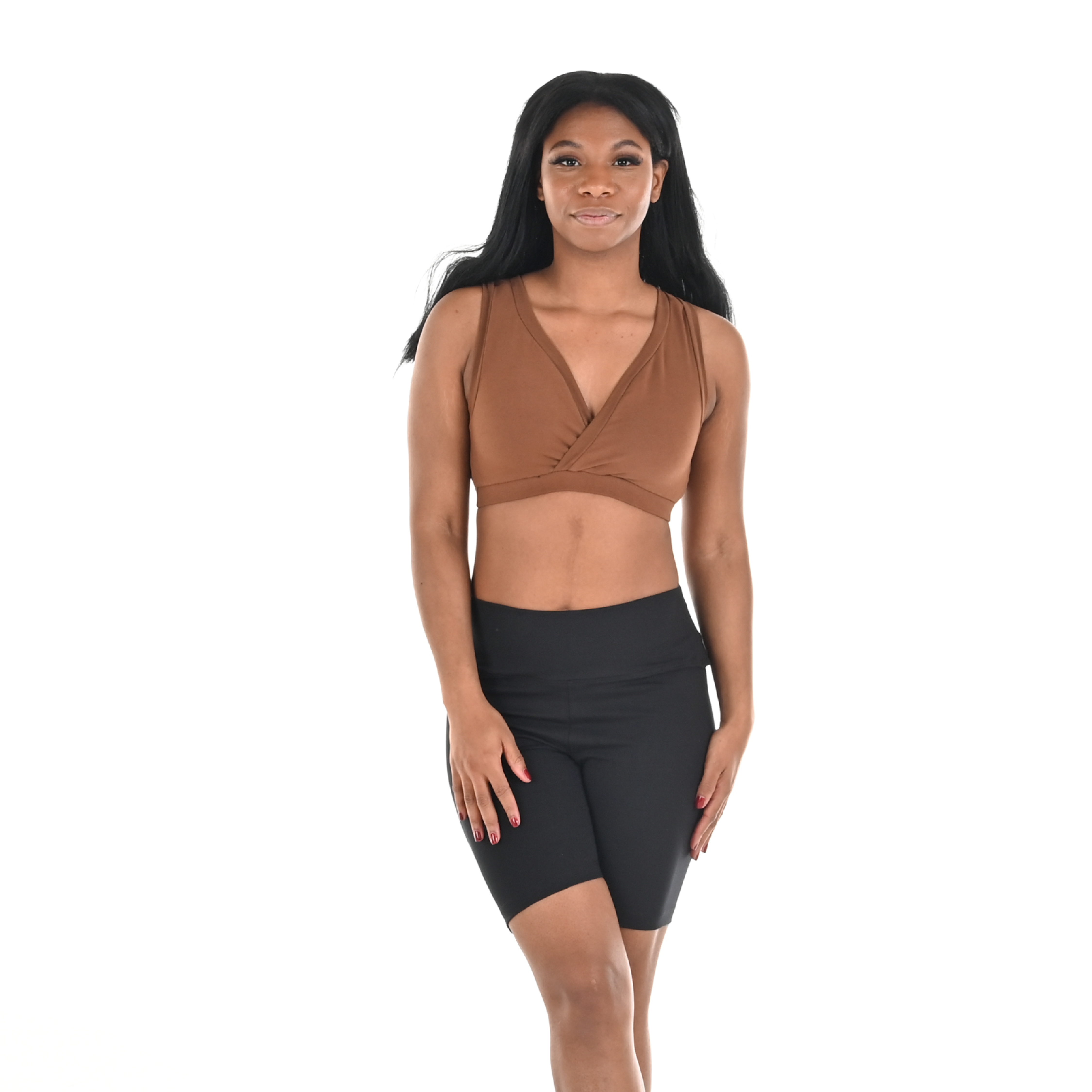 Precious is wearing black high waist cotton cycling shorts and a nude bra