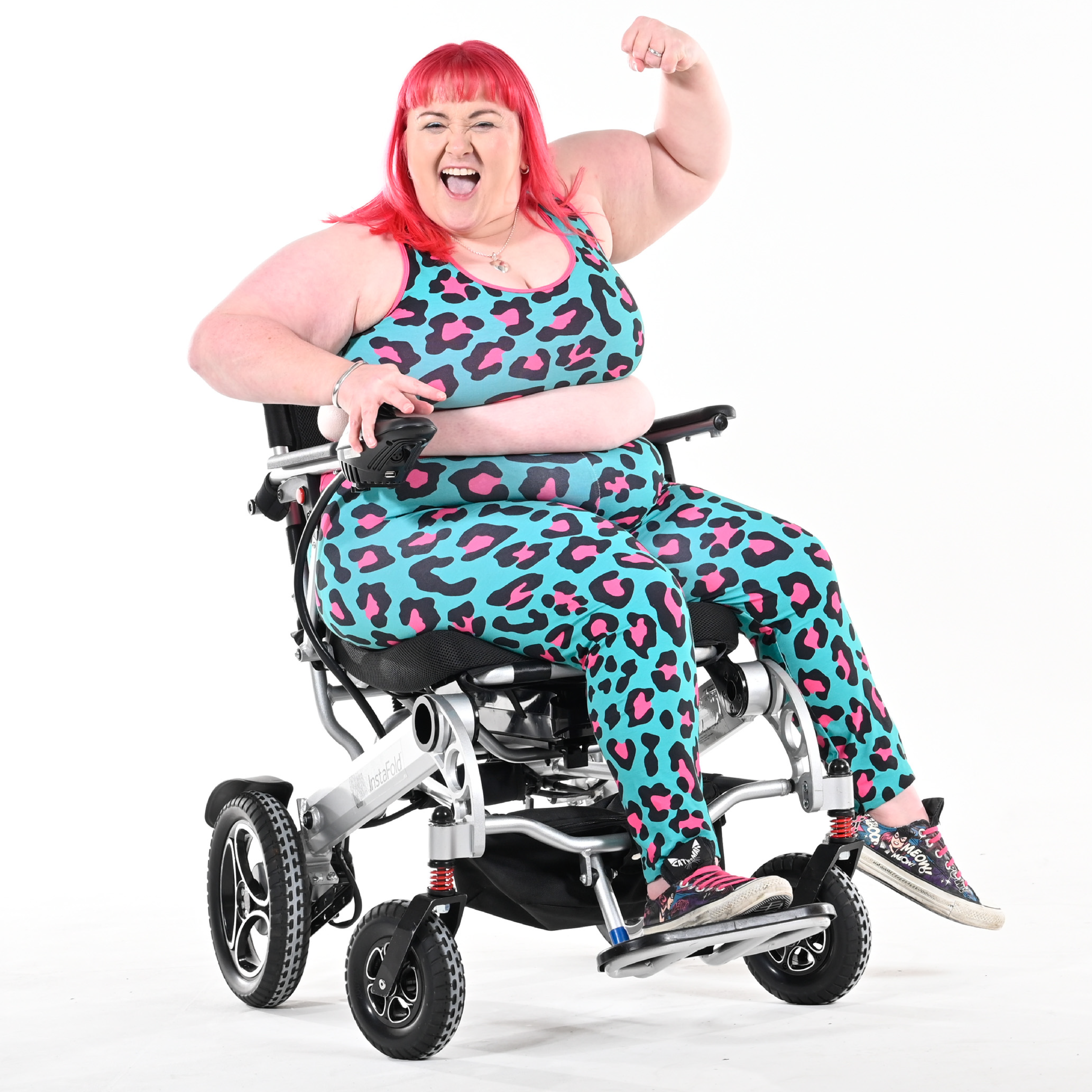 Rhona is wearing a hot leopard bralette and leggings in her electric chair