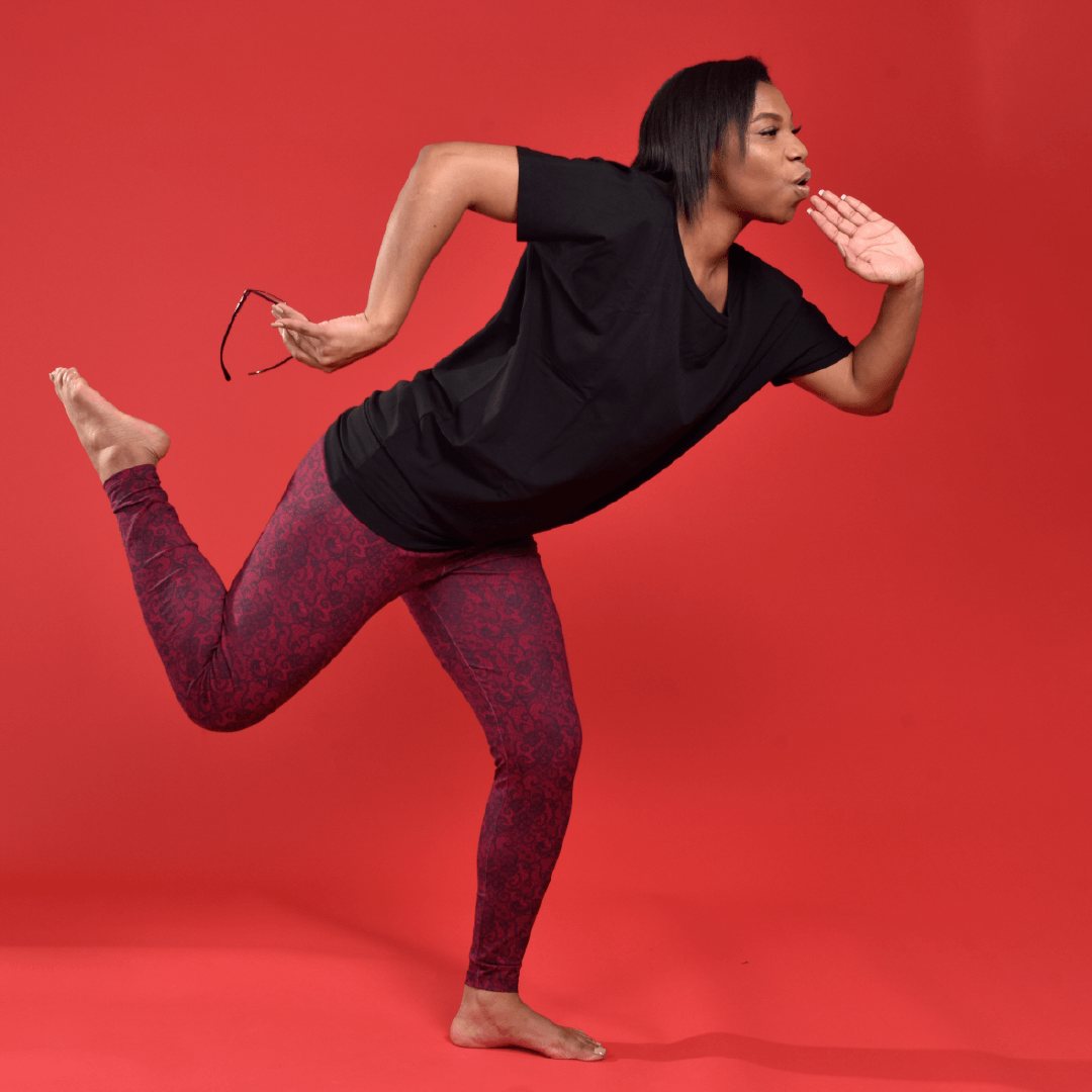 Precious is wearing cherry lace leggings and black flashtop.  She is in a running pose